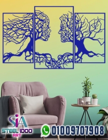 لوحة فنية لوجهين بفروع الشجر