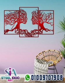 لوحة فنية لوجهين بفروع الشجر