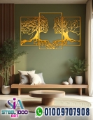 لوحة فنية لوجهين بفروع الشجر